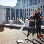 attractive Caucasian woman and man are posing to the camera